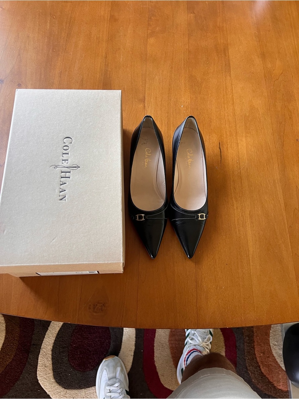 Cole Haan Black Pointed Toe Leather Pumps with Gold Buckle